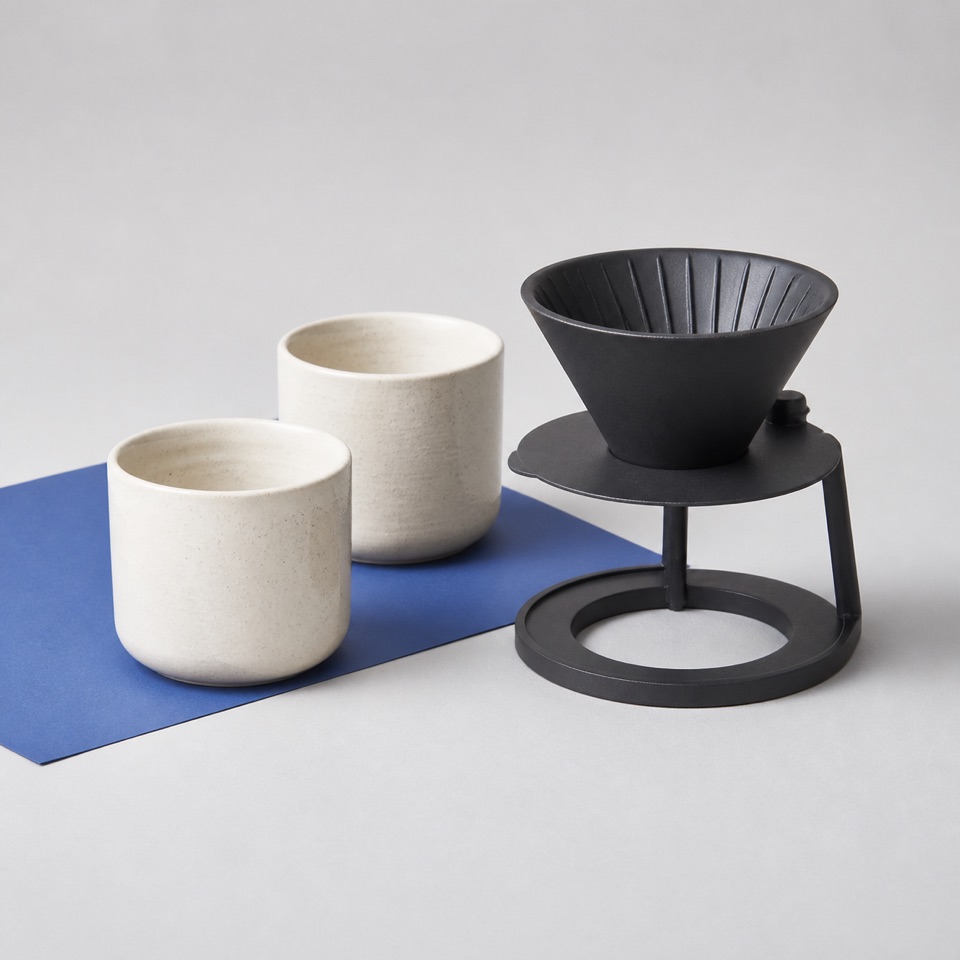 Stoneware cups and a pour-over brewer from the collection
